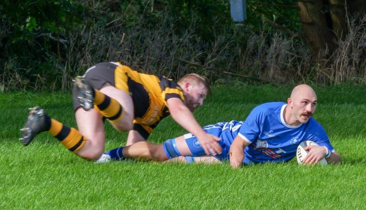 James Hart scores a try for The Blues. Picture William John
